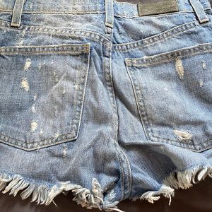 Blue shorts ripped from carmar